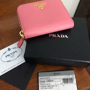 Prada pink leather compact wallet.